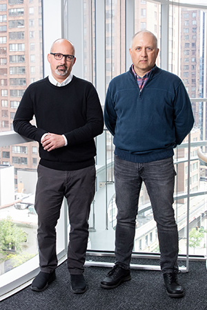 Fernando Silva and Andrei Turinsky stand together in the SickKids Research Institute.