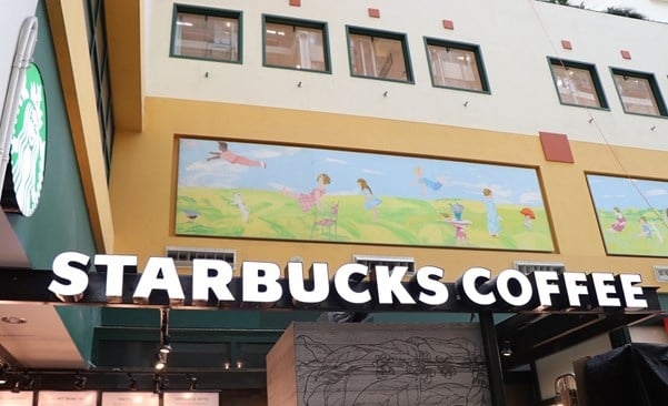 Starbucks signage displayed on a wall.