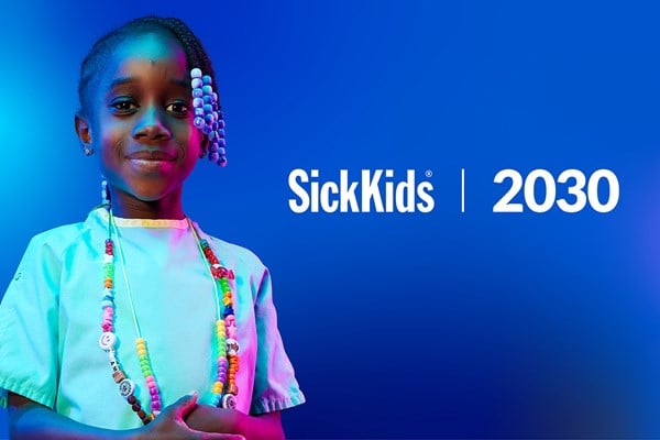 A child wearing Bravery Beads around her neck. SickKids 2030.