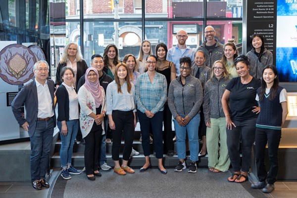 A group photo of the Clinical Pharmacology & Toxicology team shot in the PGCRL lobby.