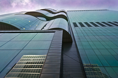 An exterior view of the Peter Gilgan Centre for Research and Learning where windows are curved like waves.