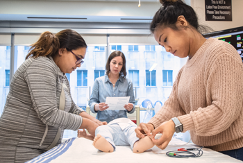 Clinicians learn technique on a robot doll