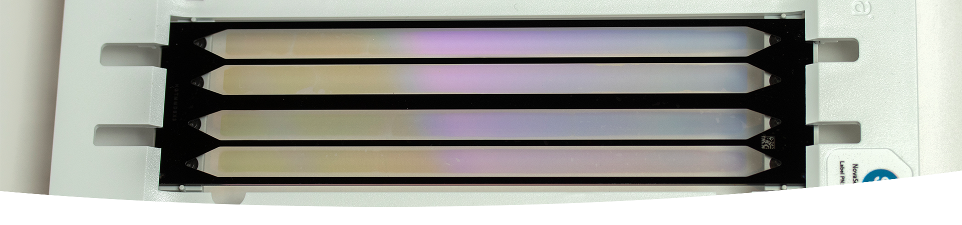 Patterned flow cell technology. A rectangular piece of equipment with tiny wells arranged in an array.