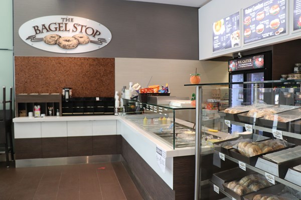 Bagel Stop glass counter, with bagels and coffee in view