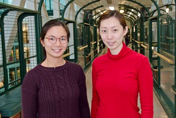 Two women stand side by side.