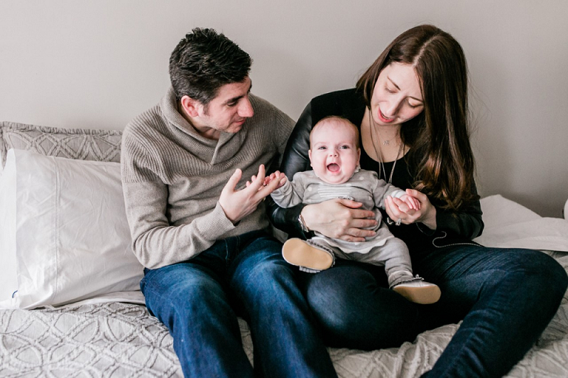 Man and woman hold a baby.