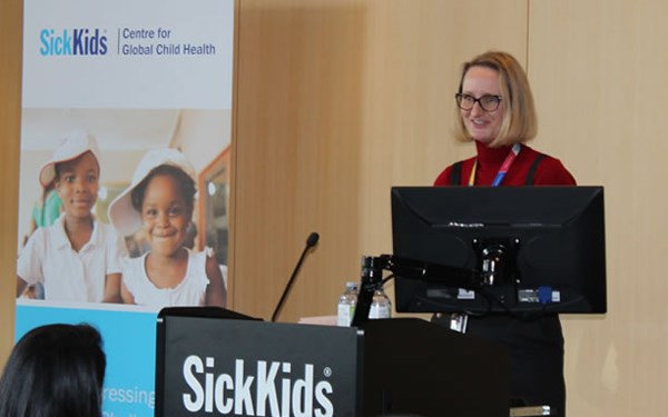 Claudia Schauer speaking at a podium