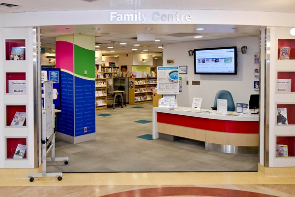 The Family Centre entrance includes a clear sign above the door, welcome desk with a screen of rotating messages and plenty of health information resources.