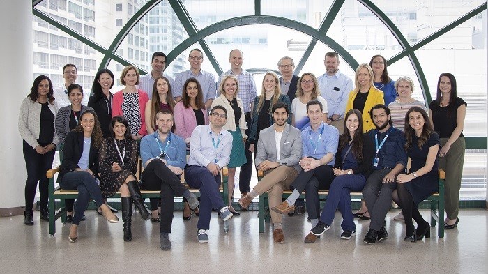 Group photo of the GHN team, 26 smiling staff