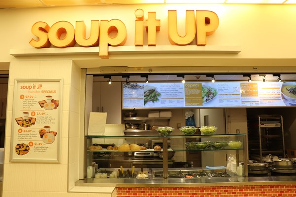 Soup it Up food stall facing the counter and menu board.