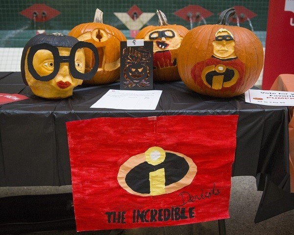 Pumpkins painted, carved and decorated to look like the characters from the movie The Incredibles.