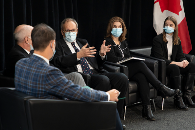 MP Adam van Koeverden talks with Helena Kirk and CPCC co-leads Dr. David Malkin, Dr. Jim Whitlock and Adrienne Co-Dyre.