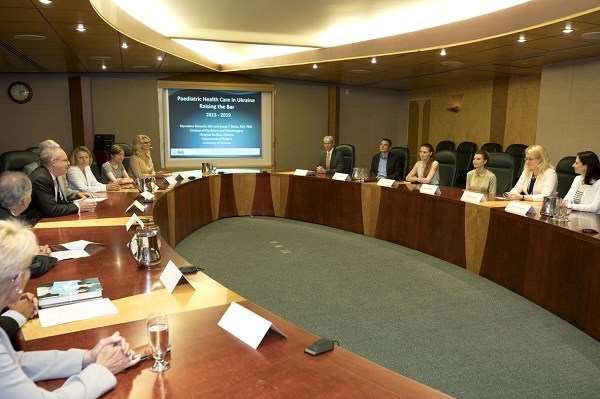 Members of Ukraine Paediatric Fellowship program site at a roundtable with the First Lady of Ukraine talking
