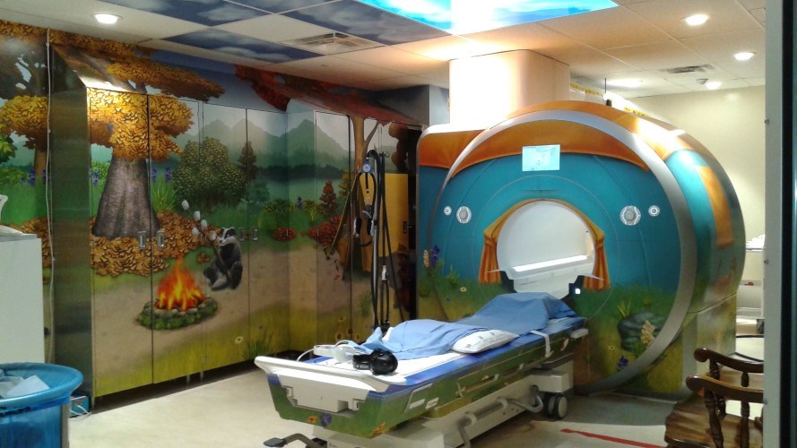 MRI Machine at SickKids in a room with jungle murals all over