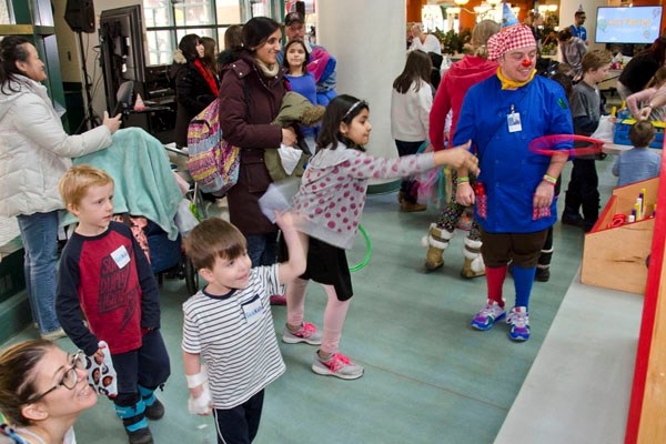 Children play ring toss.