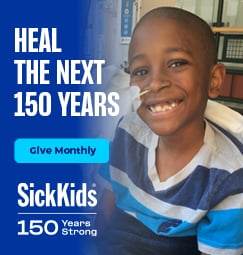 An infant wearing Bravery Beads and smiling. Join us to health the future. Give monthly.