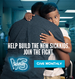 A child hugging an adult. The text reads, "Help build the new SickKids. Join the fight." Below, there is the SickKids VS logo and text that reads "Give monthly".