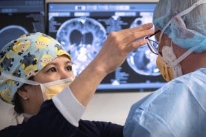 a nurse is adjusting the glasses on a child