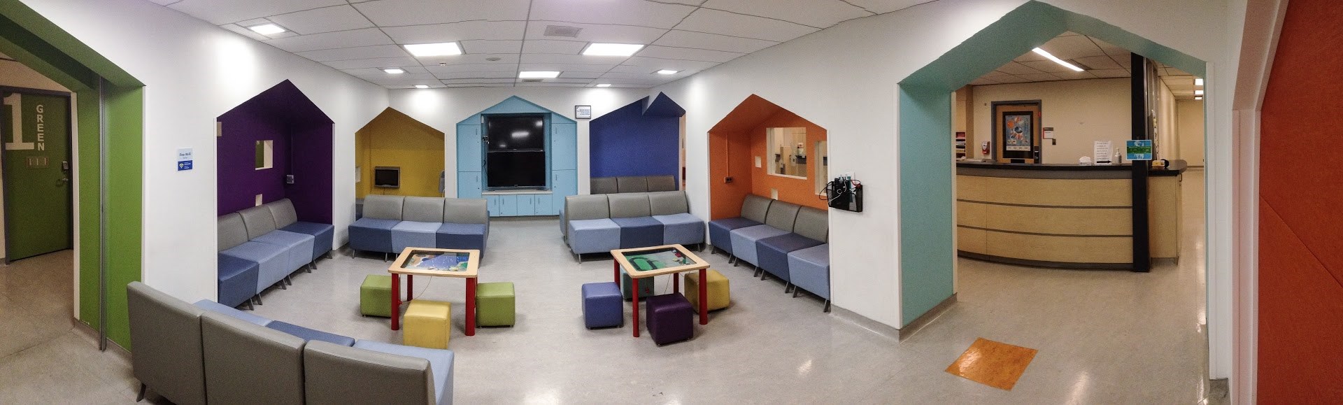 Department waiting room with colourful chairs and tables