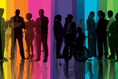 Silhouettes of people standing and talking with each other in front of a multicoloured background.
