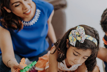 Mother and daughter playing together