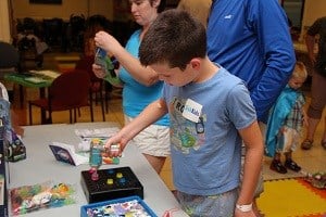 Older child plays with a toy kit.