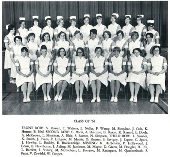Black and white group photo of women in nurse uniforms.