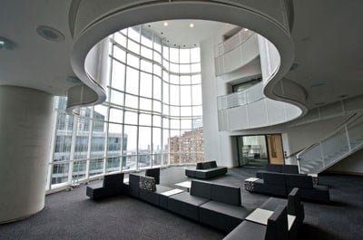 Interior view of atrium with swirling shaped balconies.