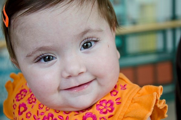 11 month old girl smiling