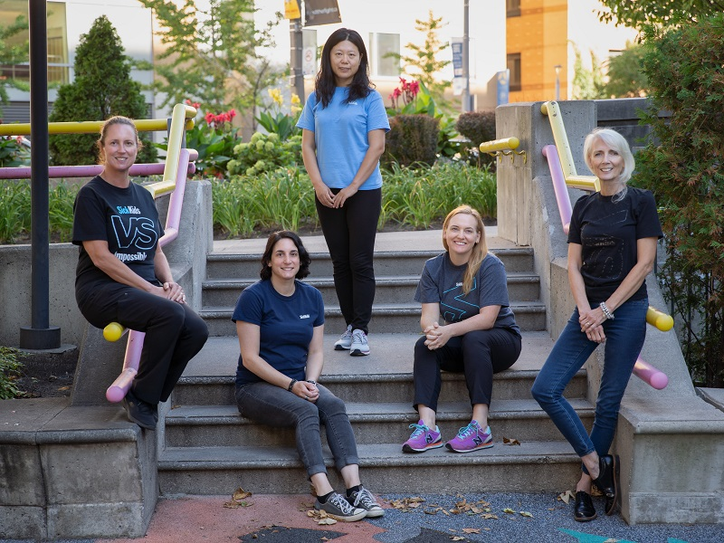 Five women gathered outside.