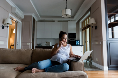 Pregnant woman talks on the phone.