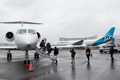 People walking off plane