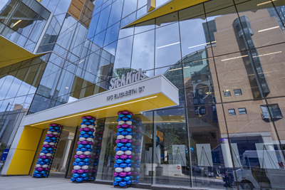 Exterior of the Patient Support Centre. The front entrance is decorated with pillars of blue, purple and white balloons.