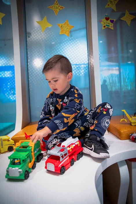Jayden playing with trucks in the WAV PlayPark