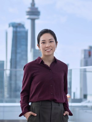 Portrait of Dr. Jennifer Quon, with the Toronto skyline in the background.