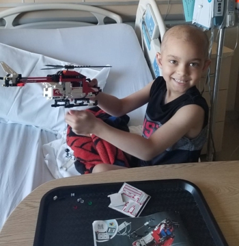 Owen Hayes in bed at SickKids
