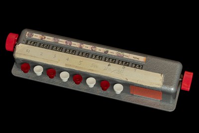 A rectangular metal device with eight keys and tally counters that correspond to each key, plus another counter that gives the total cell count. Above the counters are small illustrations of various types of white blood cells. 