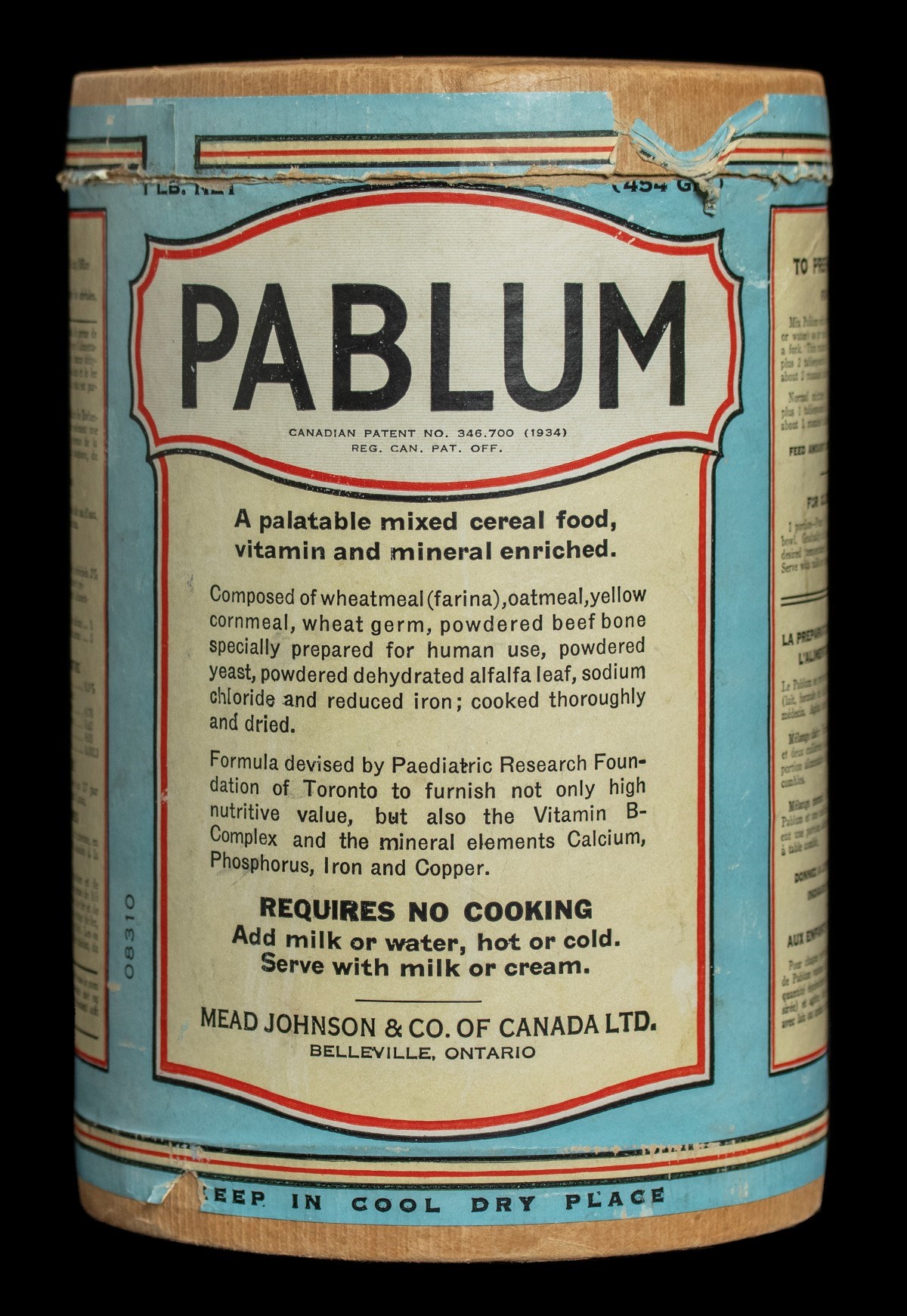 Close-up of Pablum can label. The main text reads, "A palatable mixed cereal food, vitamin and mineral enriched" and "Requires no cooking. Add milk or water, hot or cold. Serve with milk or cream".