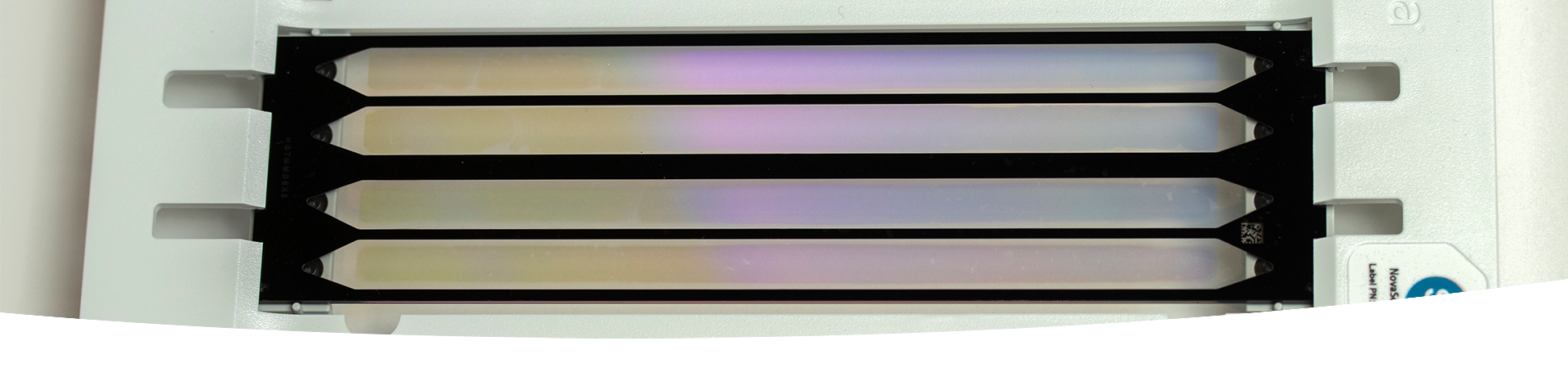 Patterned flow cell technology. A rectangular piece of equipment with tiny wells arranged in an array.