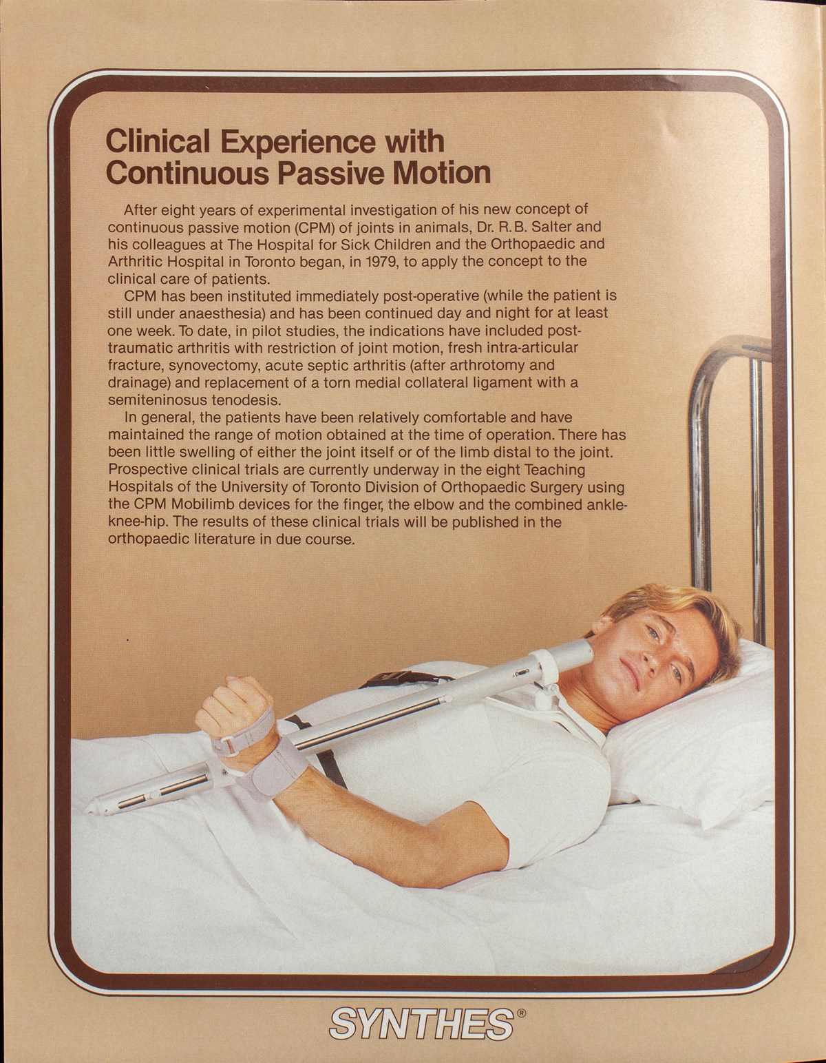 A poster of a man lying in a bed and wearing an orthotic device on arm that is connected to a bar that restricts his range of motion vertically. The headline reads "Clinical experience with continuous passive motion".