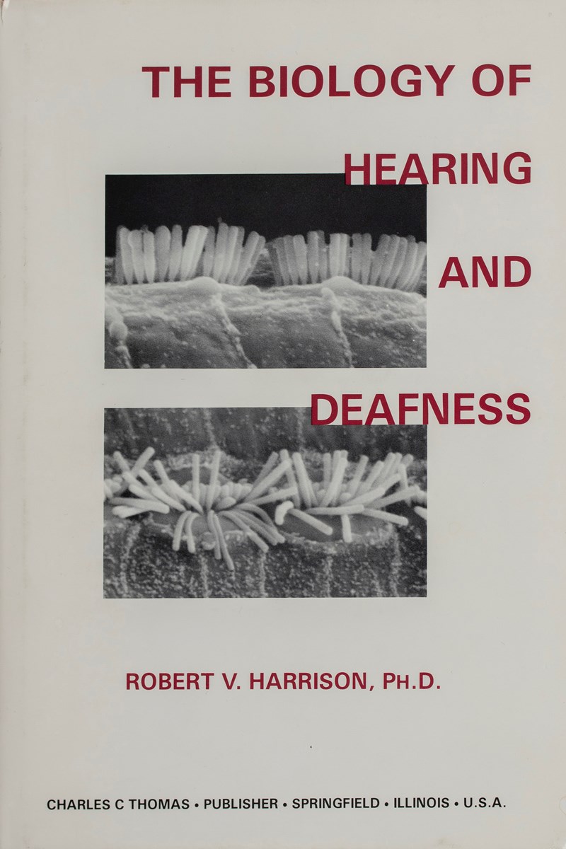 The cover of The Biology of Hearing and Deafness. The cover features black and white images of hair cells in the inner ear.